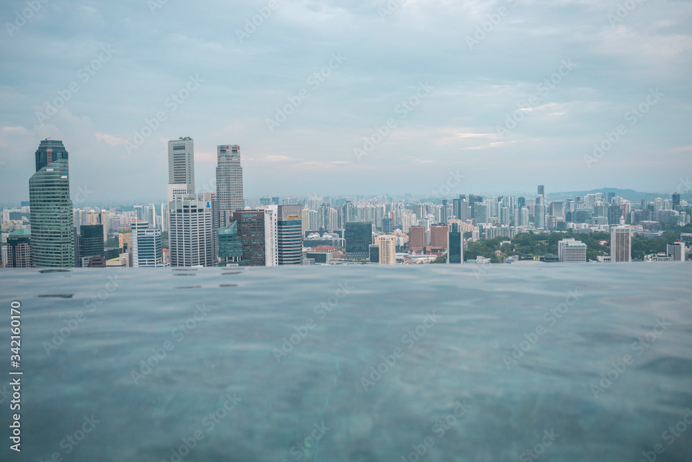 Panoramic view of the Singapore skyling from the infinity pool of the Marina Bay Hotel