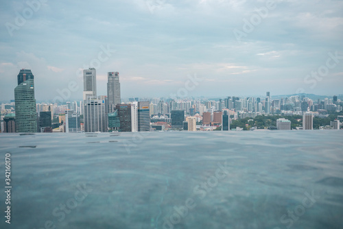 Panoramic view of the Singapore skyling from the infinity pool of the Marina Bay Hotel