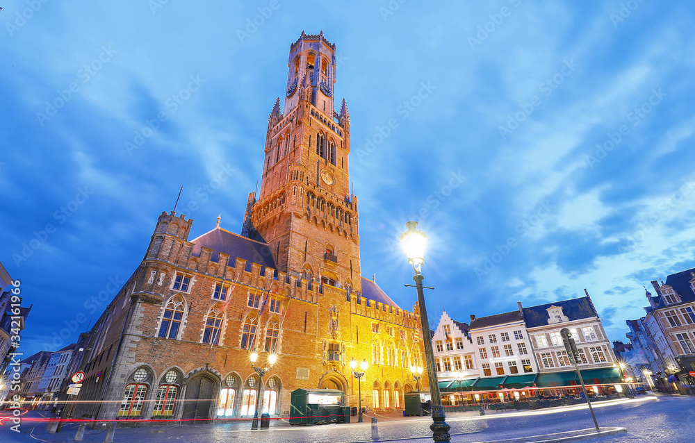 Belfry Tower in historical center of Bruges at night, Belgium.