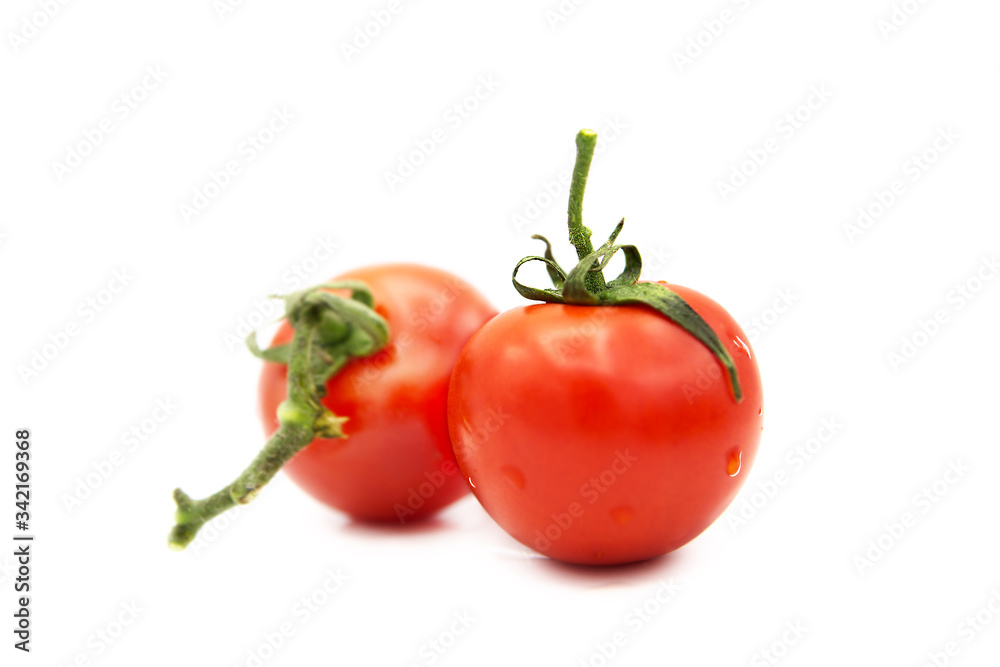 Two ripe fresh organic tomatoes with dew drops isolated on white background. Two ripe fresh organic tomatoes with dew drops isolated on white background.