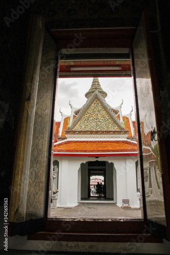 Entrance to the Wat Arun temple grounds through shadows