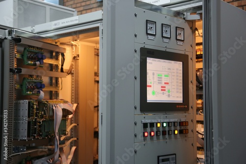 excitation system cabinet in thermo power plant. electronic cards and HMI panel is on the cubical