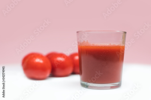 Wallpaper Mural A glass of freshly squeezed tomato juice. 
 Fresh tomato juice and tomatoes on the background. Healthy eating and healthy lifestyle. Torontodigital.ca