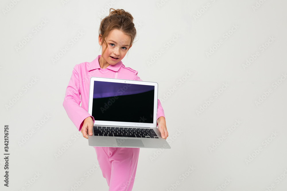 contented caucasian girl holding a laptop with the screen forward with the layout for the page on a white background contented caucasian girl holding a laptop with the screen forward with the layout for the page on a white background