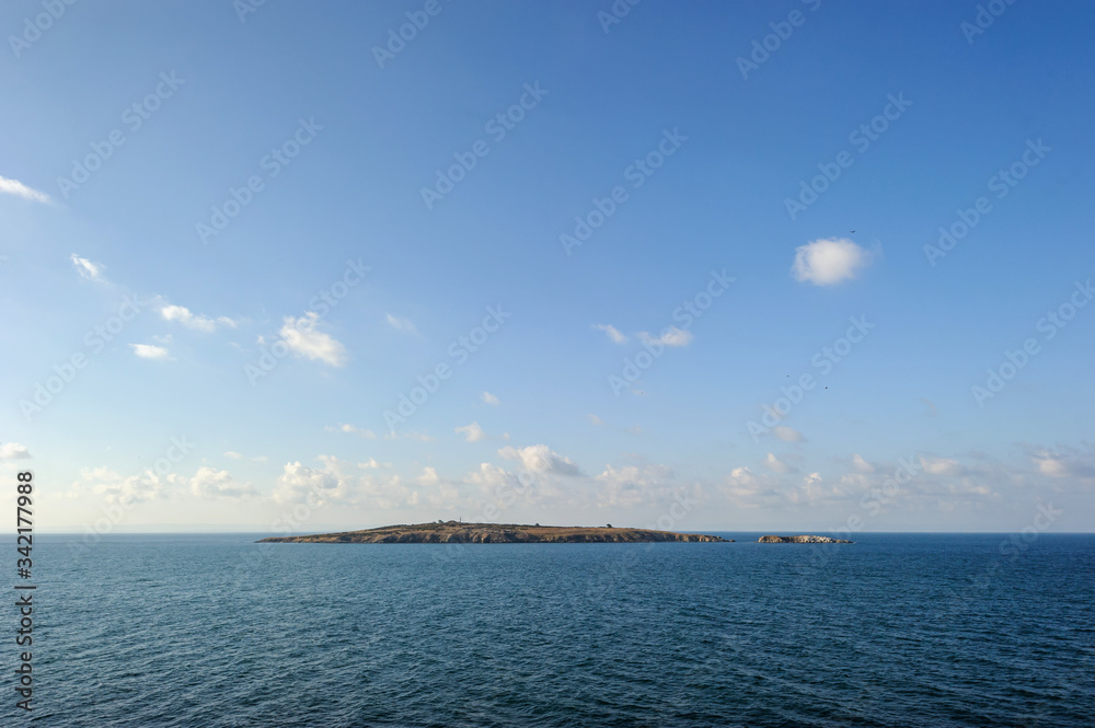 Obraz premium Island in the black sea against the blue sky. Sozopol, Burgas region, Bulgaria.