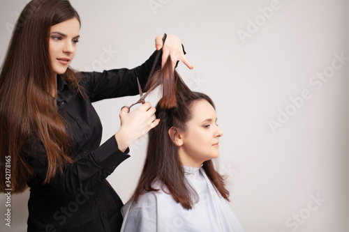 Professional hairdresser does hair care procedures at home