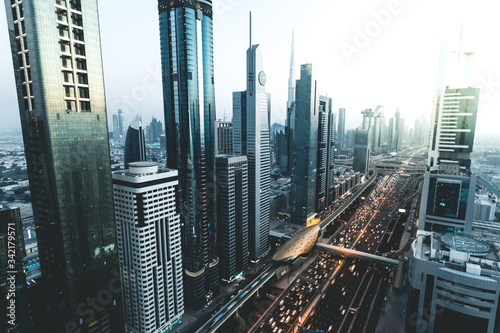 View of traffic and skyline from rooftop at sunset Dubai - UAE