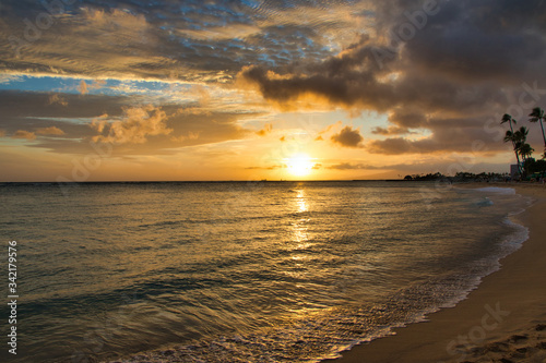 Golden sunset from the beach at Waikiki on Oahu.