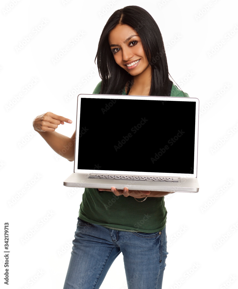 Young smiling woman holding and pointing at laptop screen, left black fop mockup. Young smiling woman holding and pointing at laptop screen, left black fop mockup.