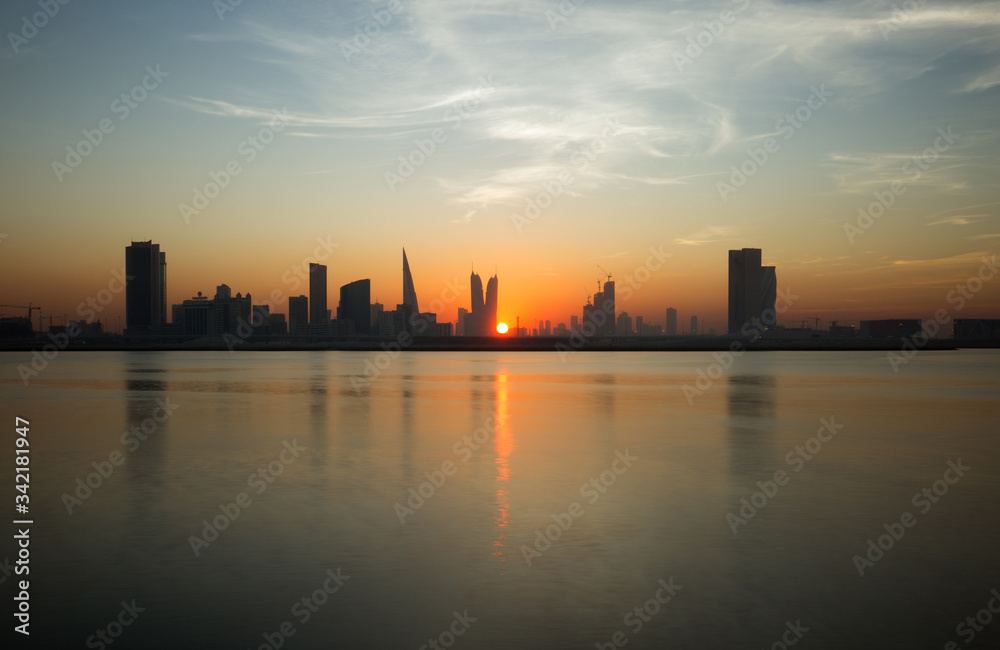 Beautiful sun in the mid of Bahrain skyline during sunset Beautiful sun in the mid of Bahrain skyline during sunset