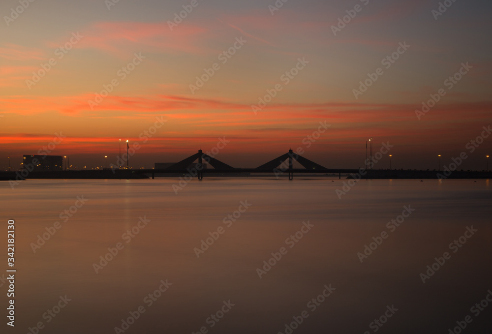 Obraz premium Sheikh Salman Causeway bridge, the design with two sail-like structures depict Bahrains traditional pearl diving