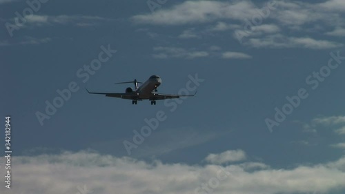 Passenger jet flying low over Manchester airport photo