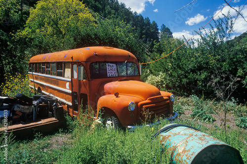 A junk bus in a ghost town in Holland, New Mexico