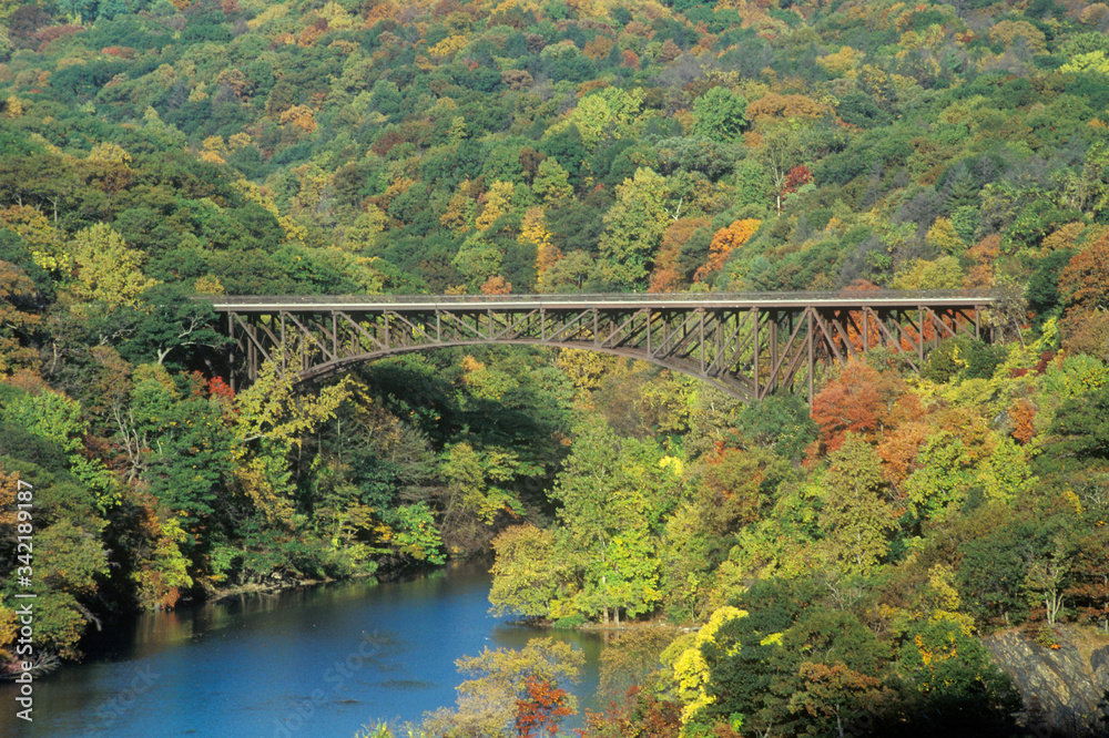 The Bear Mountain Bridge, located in Bear Mountain State Park, New York, spans the Hudson River The Bear Mountain Bridge, located in Bear Mountain State Park, New York, spans the Hudson River