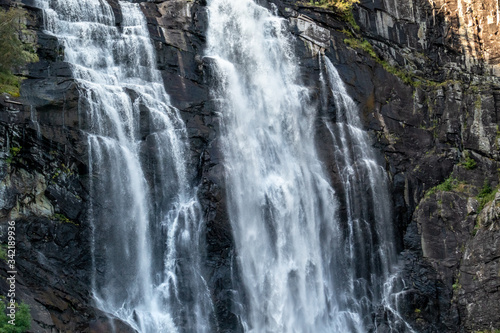 Skjervefossen norwegian landmark high powerful cascade waterfall. Nature travel clean falling water horizontal landscape
