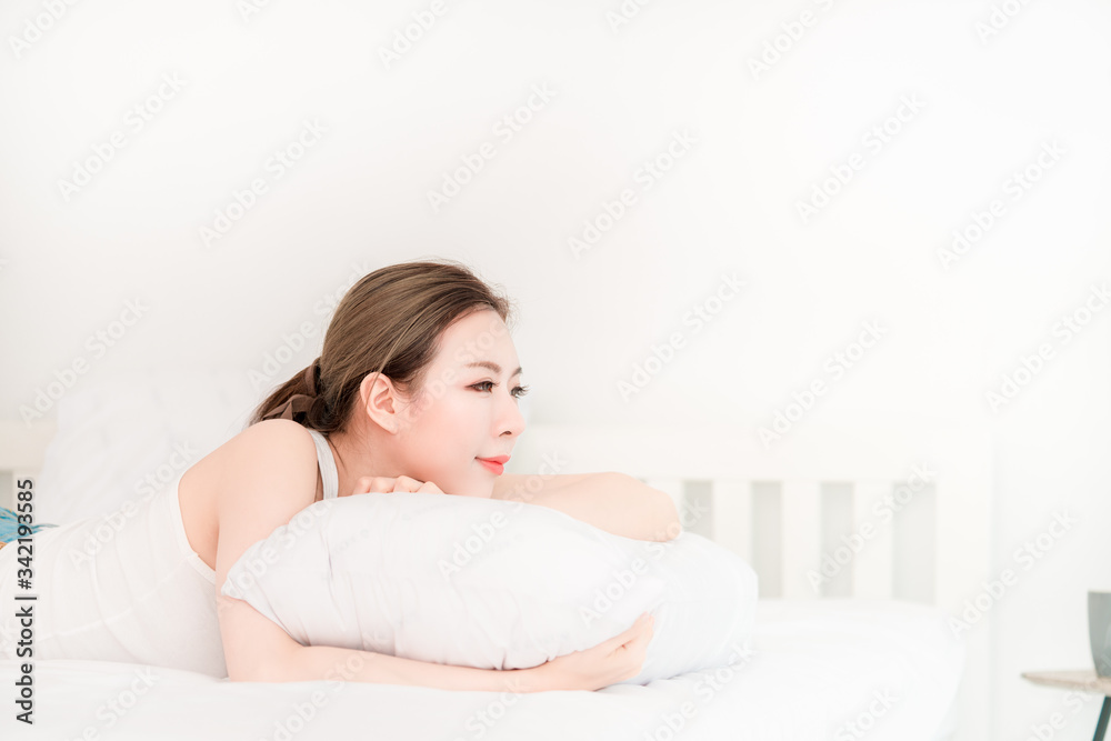 Young beautiful asian girl with long hair sleeping on white bed using as background cosmetics woman beauty makeup fashion people model concept. Young beautiful asian girl with long hair sleeping on white bed using as background cosmetics woman beauty makeup fashion people model concept.