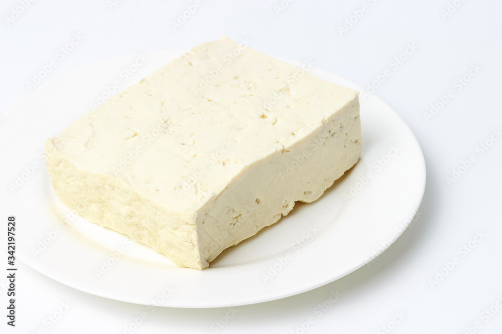soy tofu on a plate on a white background, close-up