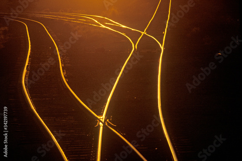 Railroad tracks shine at sunset in East Saint Louis, Missouri photo
