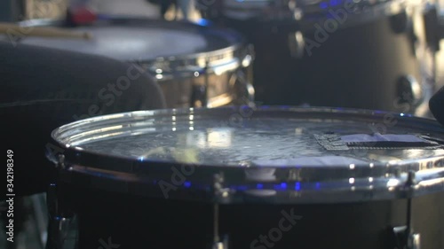 Drummer playing on stage at music festival photo