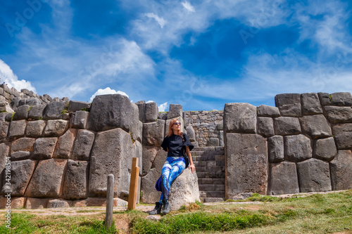 In front of the wall of Incas in Cusco (ID: 342198514)