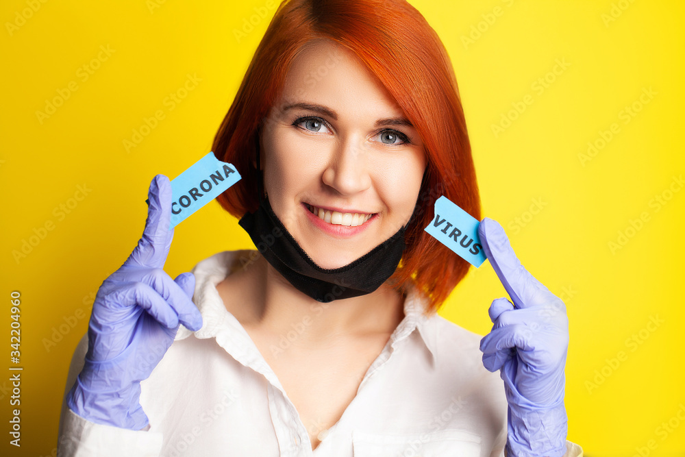 Woman in protective gloves holding inscription coronavirus. Woman in protective gloves holding inscription coronavirus.