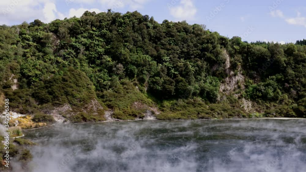 Wide shot of steam flowing over the surface of Frying pan Lake, Waimangu Volcanic Valley, Rotorua, New Zealand Wide shot of steam flowing over the surface of Frying pan Lake, Waimangu Volcanic Valley, Rotorua, New Zealand
