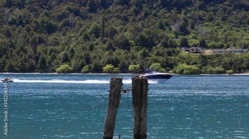 Speed boat towing inflatable at Bob's Cove, Queenstown, Otago, New Zealand photo