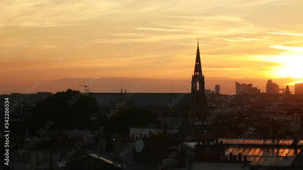 Paris skyline with roofs and Eiffel Tower during sunset Paris skyline with roofs and Eiffel Tower during sunset
