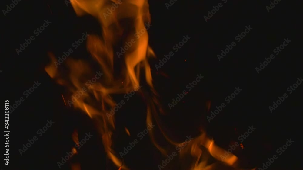 Slow motion of a Bonfire lit at night during the cold winter months to give warmth to the campers of the trek during the chilly nights of the Western Ghats of India Slow motion of a Bonfire lit at night during the cold winter months to give warmth to the campers of the trek during the chilly nights of the Western Ghats of India