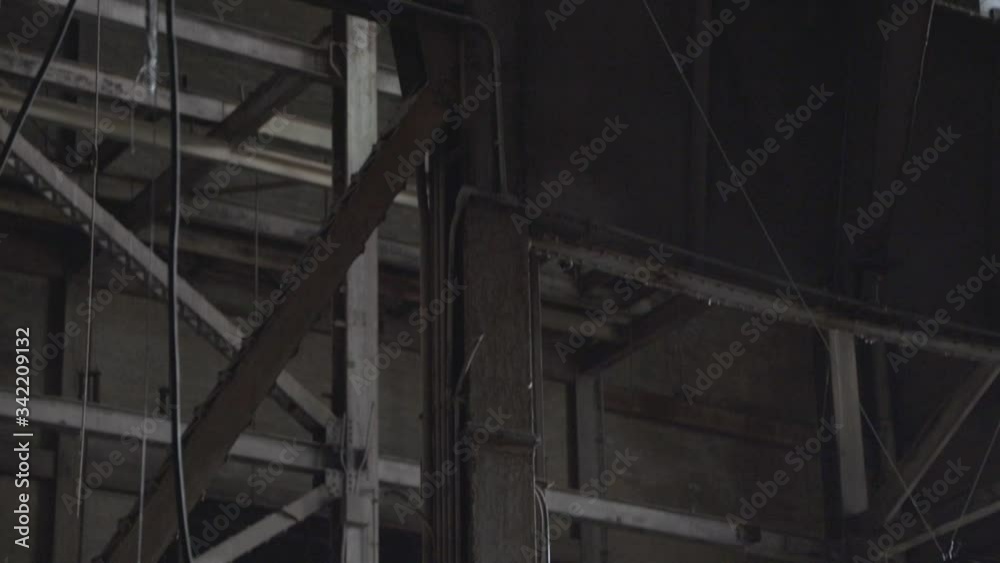 Interior Of The Abandoned Industrial Building.- tilt up shot Interior Of The Abandoned Industrial Building.- tilt up shot