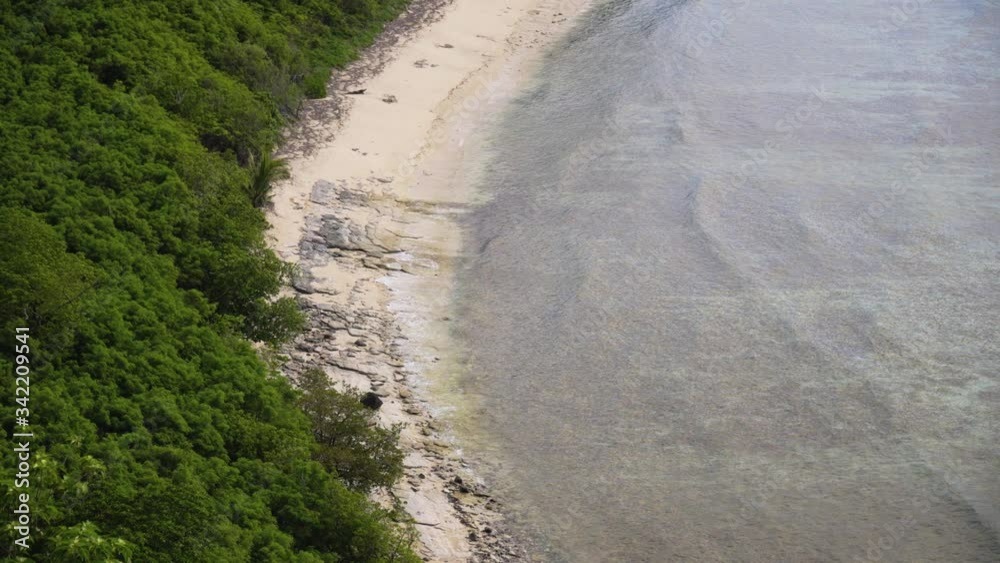 Hidden beach on a tropical island, with waves rolling onto its shore, Fiji 4K Hidden beach on a tropical island, with waves rolling onto its shore, Fiji 4K