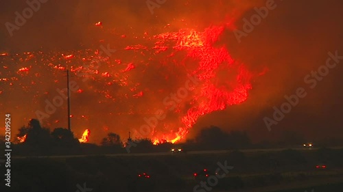 2017 - the Thomas Fire burns at night in the hills above the 101 freeway near Ventura and Santa Barbara, California. photo
