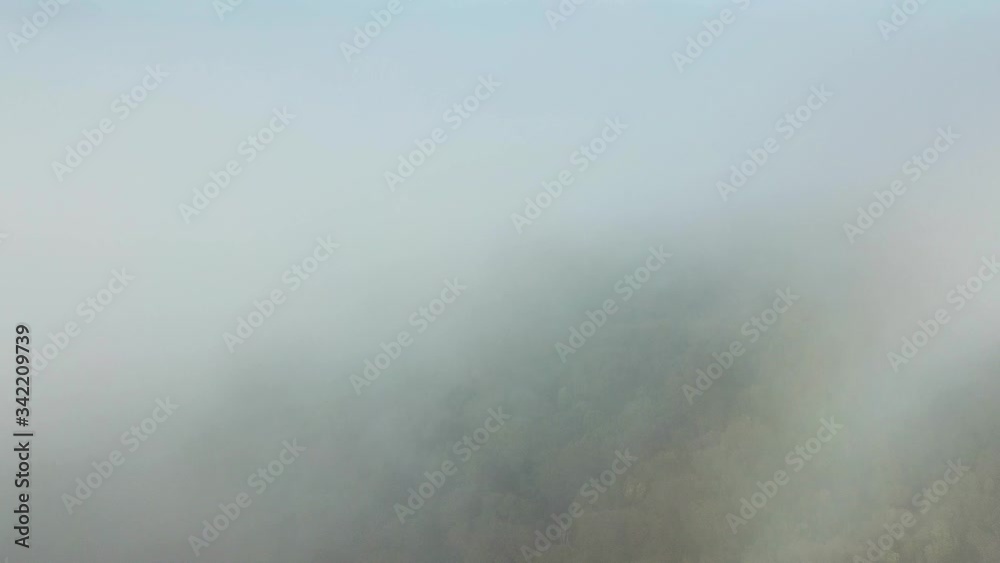 Flying Into Clouds Above Jungle and Volcanic Hills. Drone Aerial View Flying Into Clouds Above Jungle and Volcanic Hills. Drone Aerial View
