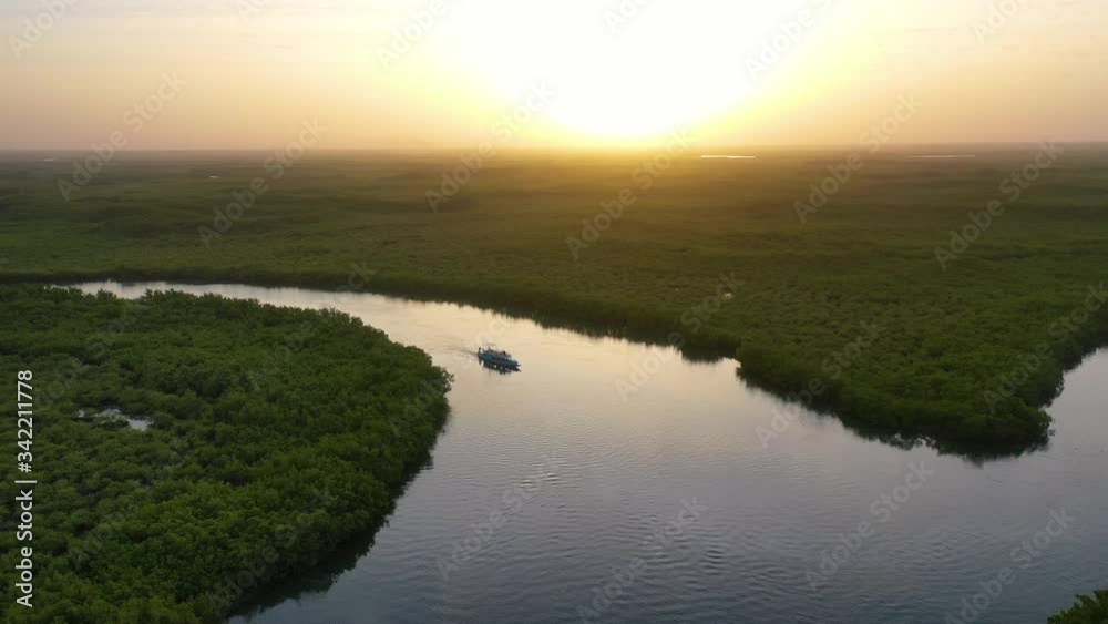 2020 beautiful aerial over small boat moving along the Gambia river