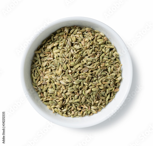 Fennel seeds in a plate placed on a white background