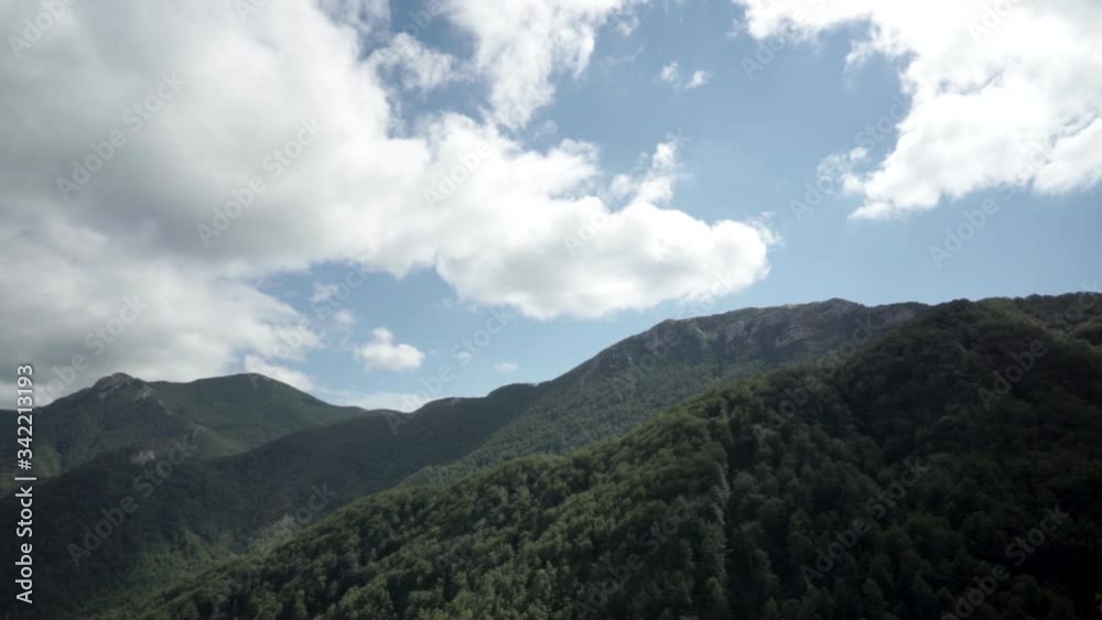 Time lapse of large cumulus clouds rolling over the tops of the Velebit mountain range, Croatia Time lapse of large cumulus clouds rolling over the tops of the Velebit mountain range, Croatia
