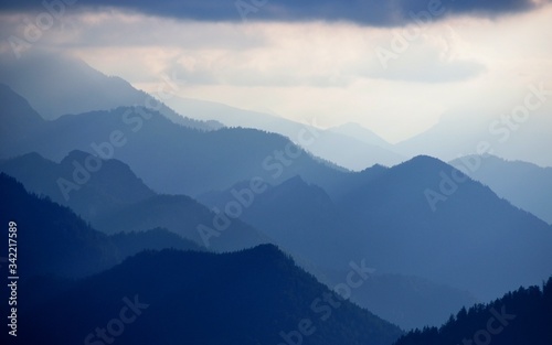 blue mountain range against back light at Chiemgau alps  Germany