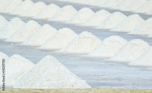 Sea salt pat  salt evaporation pond. Closeup of sea salt pile pyramid. Sea salt farming concept  in Samut Sakhon   Thailand