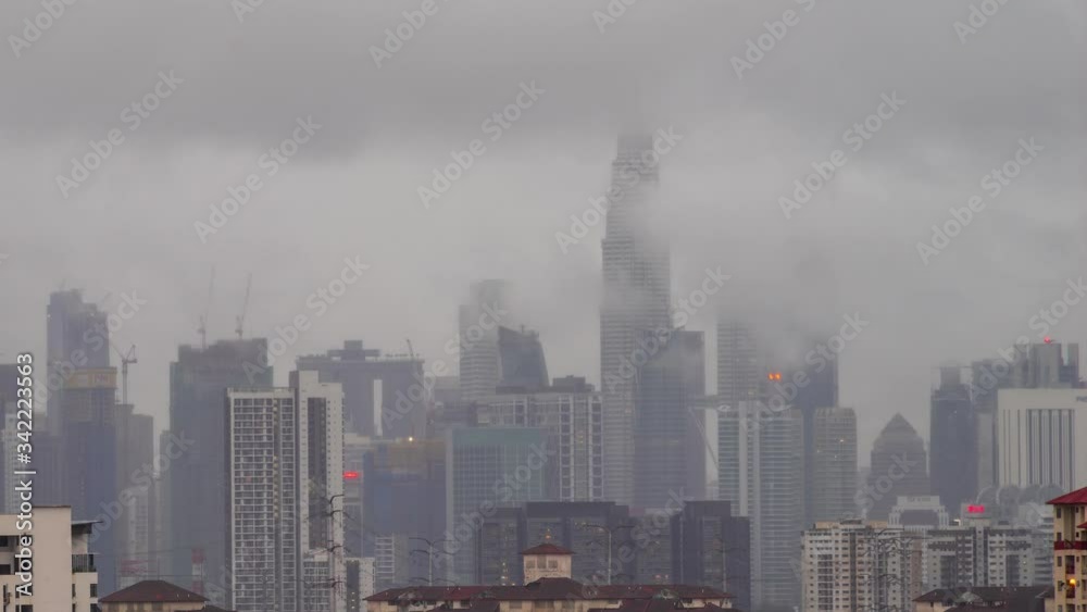 4K time lapse of monsoon rain over down town Kuala Lumpur, Malaysia Zoom In 4K time lapse of monsoon rain over down town Kuala Lumpur, Malaysia Zoom In