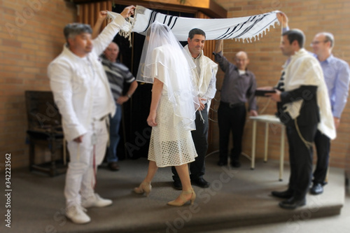 Modern Orthodox Jewish Wedding Ceremony in Synagog photo