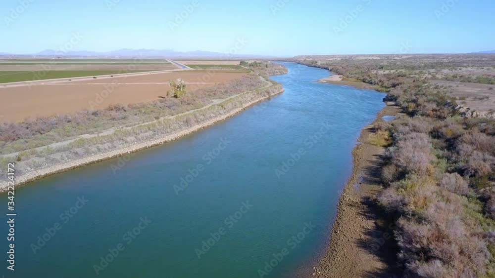 Aerial, drone shot overlooking the Colorado river, sunny day, at the border between California and Arizona, USA Aerial, drone shot overlooking the Colorado river, sunny day, at the border between California and Arizona, USA