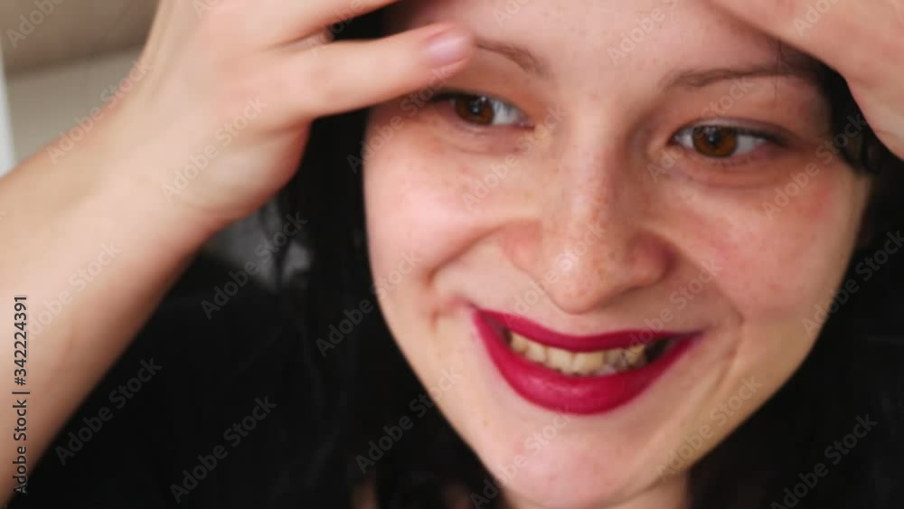 Beautiful woman with red lips.Russian girl touches your hair. Beautiful woman with red lips.Russian girl touches your hair.
