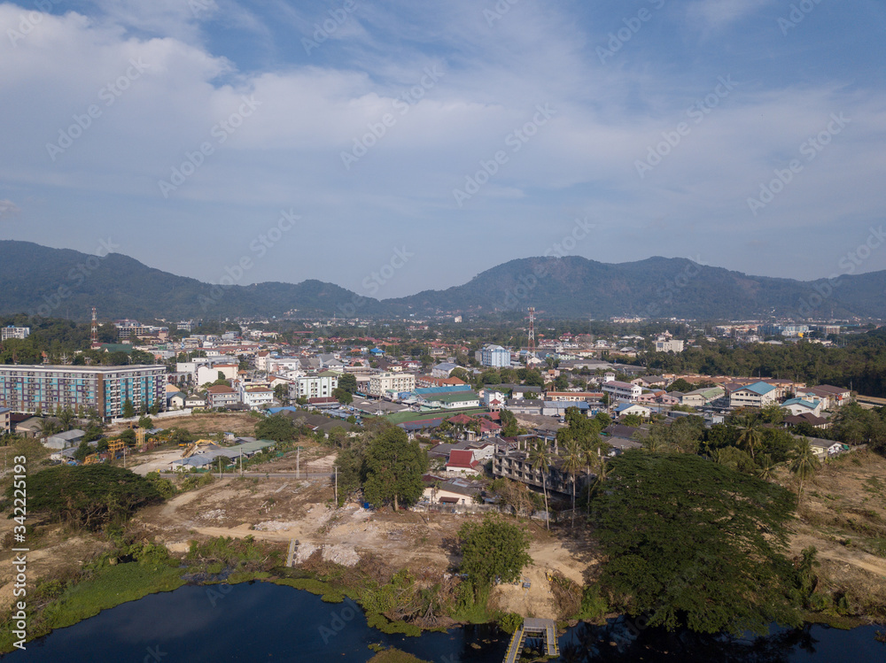 aerial view of the city around the picturesque mountains at sunrise, Kathu, Phuket