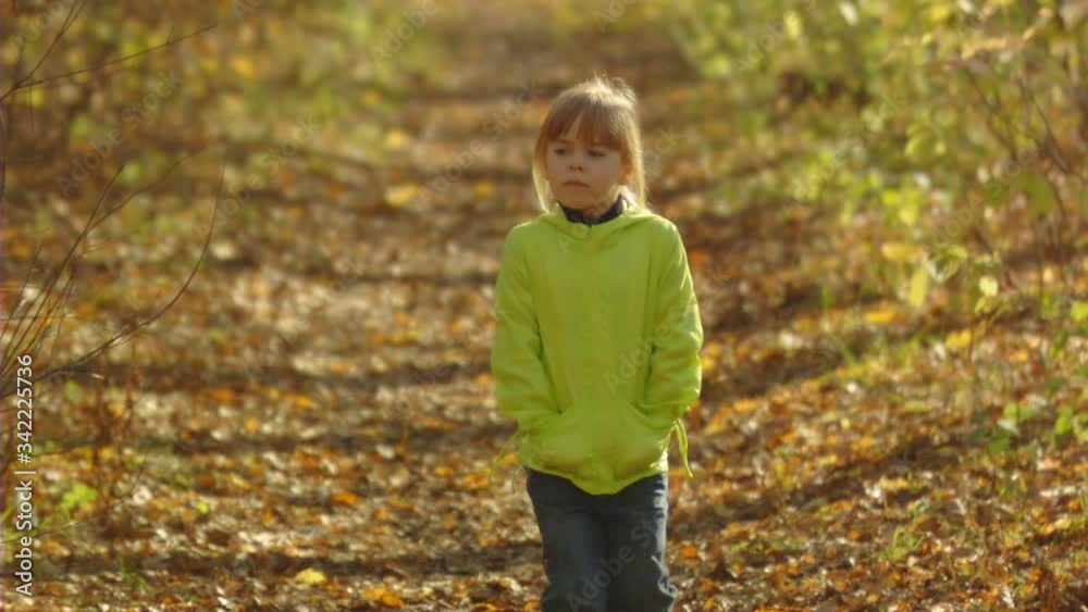 Sequence of slow motion shots of the happy mum and little girl play with autumn foliage Sequence of slow motion shots of the happy mum and little girl play with autumn foliage