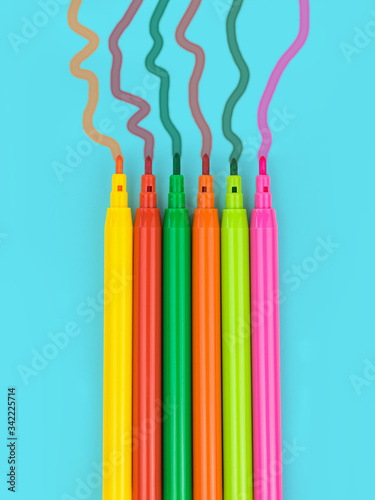 Multi-colored markers with flowing colors on a blue background.