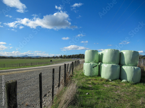 Baleage or Hay wrapped in Plastic for winter feeding of animals being stored on the farm in rural New Zealand