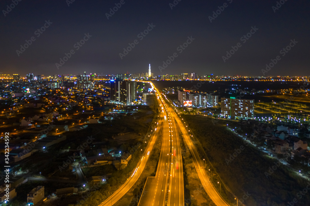 Top view aerial of Long Thanh - Dau Giay expressway at Vo Chi Cong intersection area towards Ho Chi Minh city, Vietnam, with development buildings, transportation, infrastructure. View from district 2