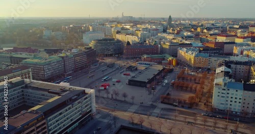 Helsinki during Coronavirus pandemic, Aerial, tracking, drone shot, Hakaniemi area, ympyratalo, hakaniementori and the Kallio, in Helsingfors, sunny, spring evening, in Finland photo