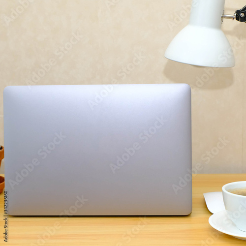 Labtop on wooden table, work from home concept