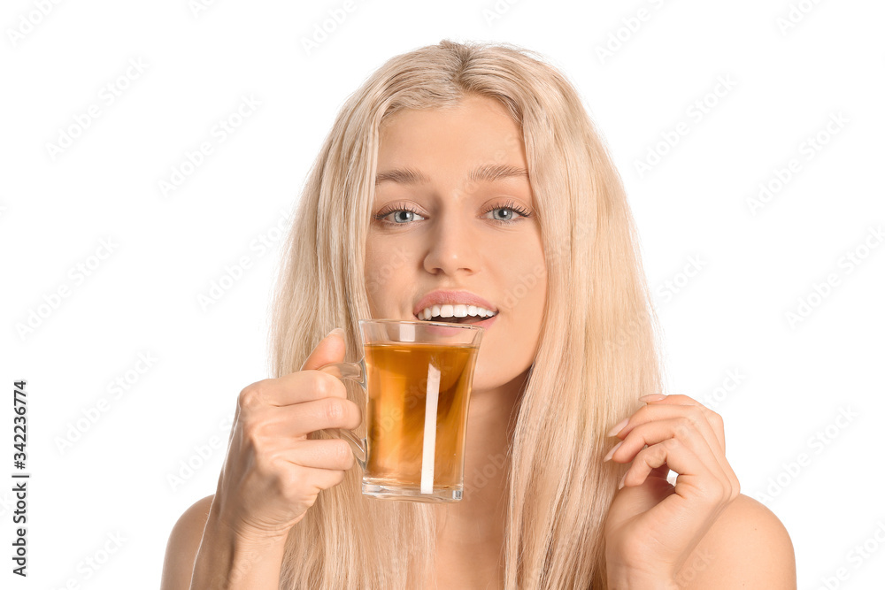 Beautiful young woman with tea on white background Beautiful young woman with tea on white background